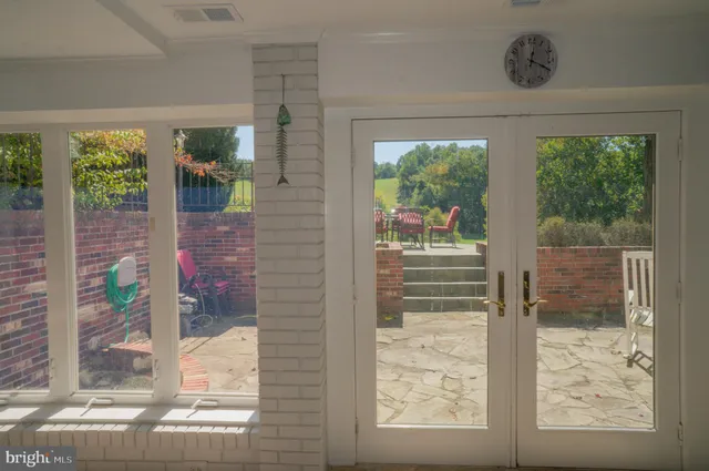 a living room with furniture and flat screen tv