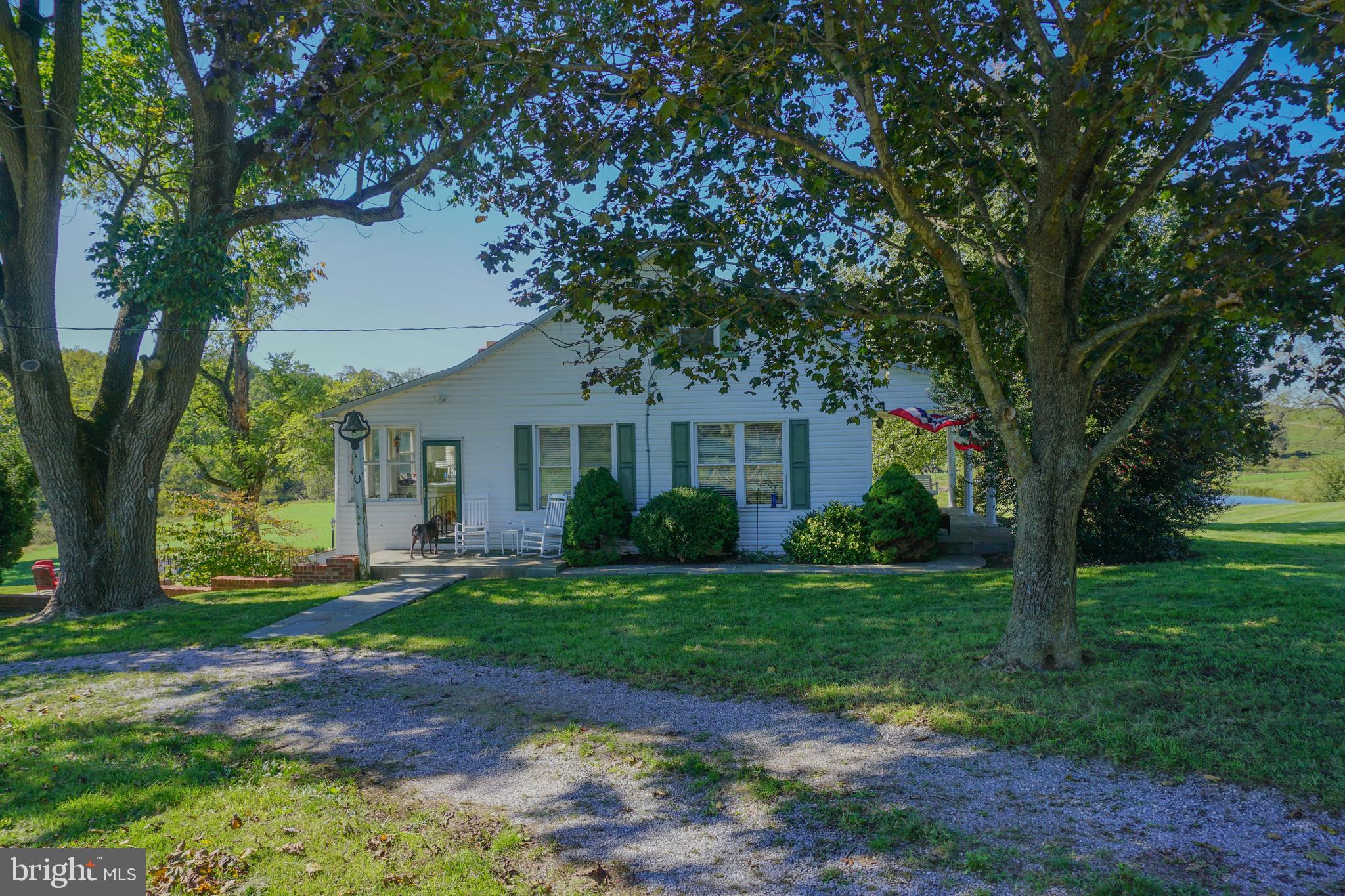 4205 Sams Creek Road New Windsor, MD 21776 - Photo 34 of 103 a front view of a house with a yard and garage