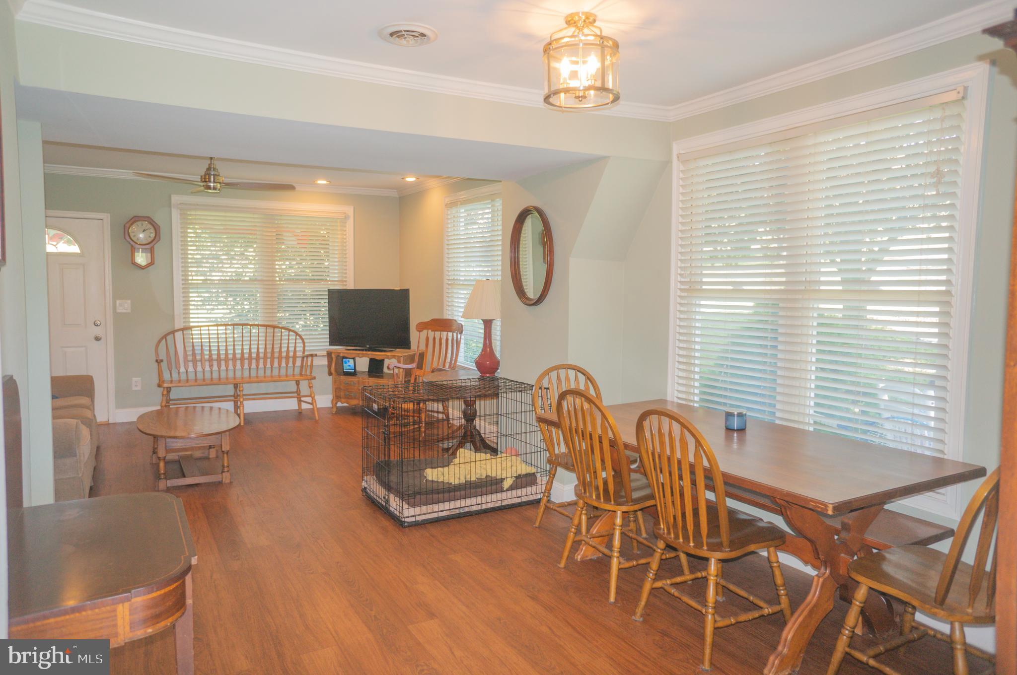 4205 Sams Creek Road New Windsor, MD 21776 - Photo 41 of 103 a living room with furniture a flat screen tv and a large window