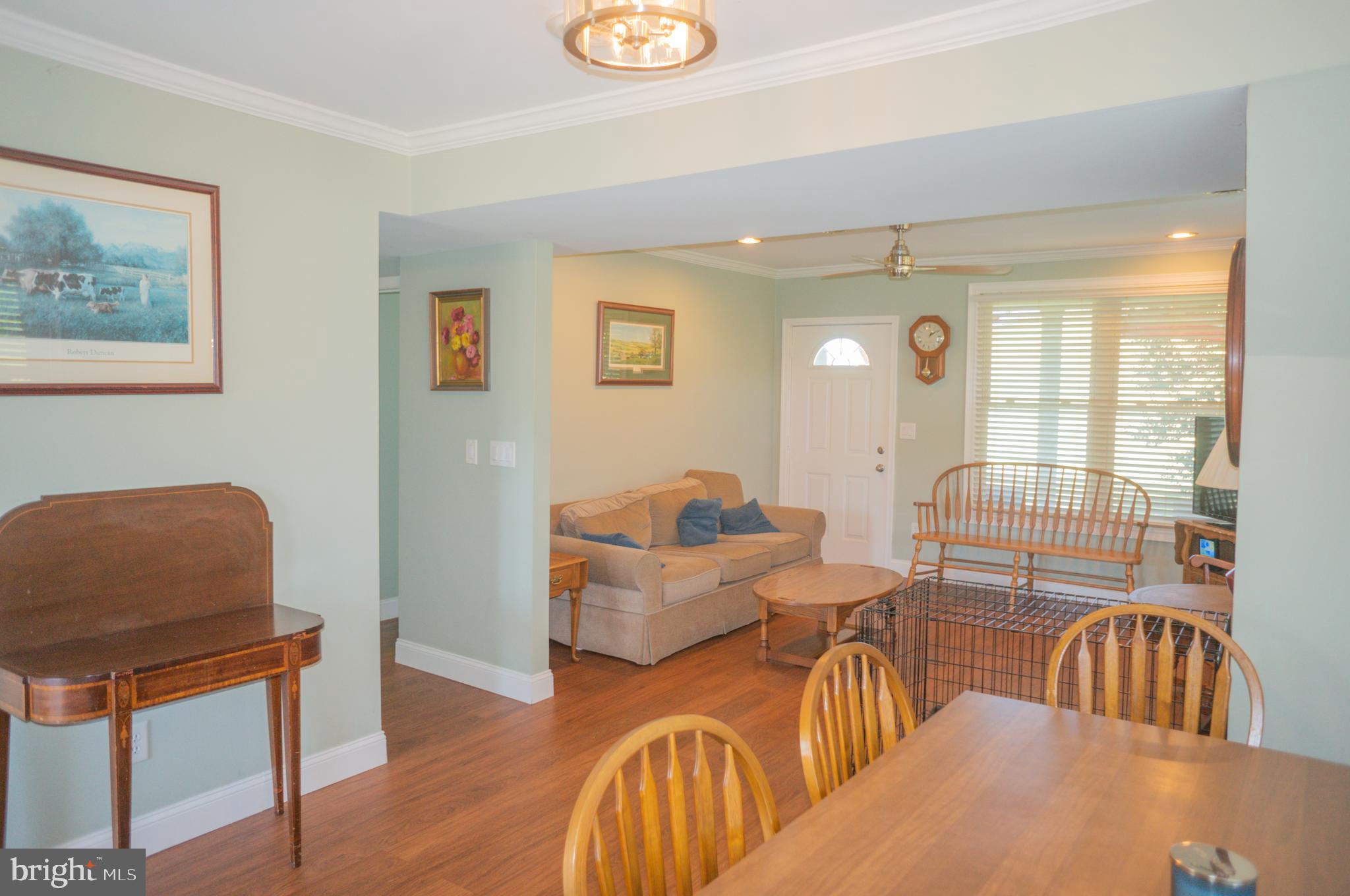 4205 Sams Creek Road New Windsor, MD 21776 - Photo 42 of 103 a living room with furniture and a wooden floor