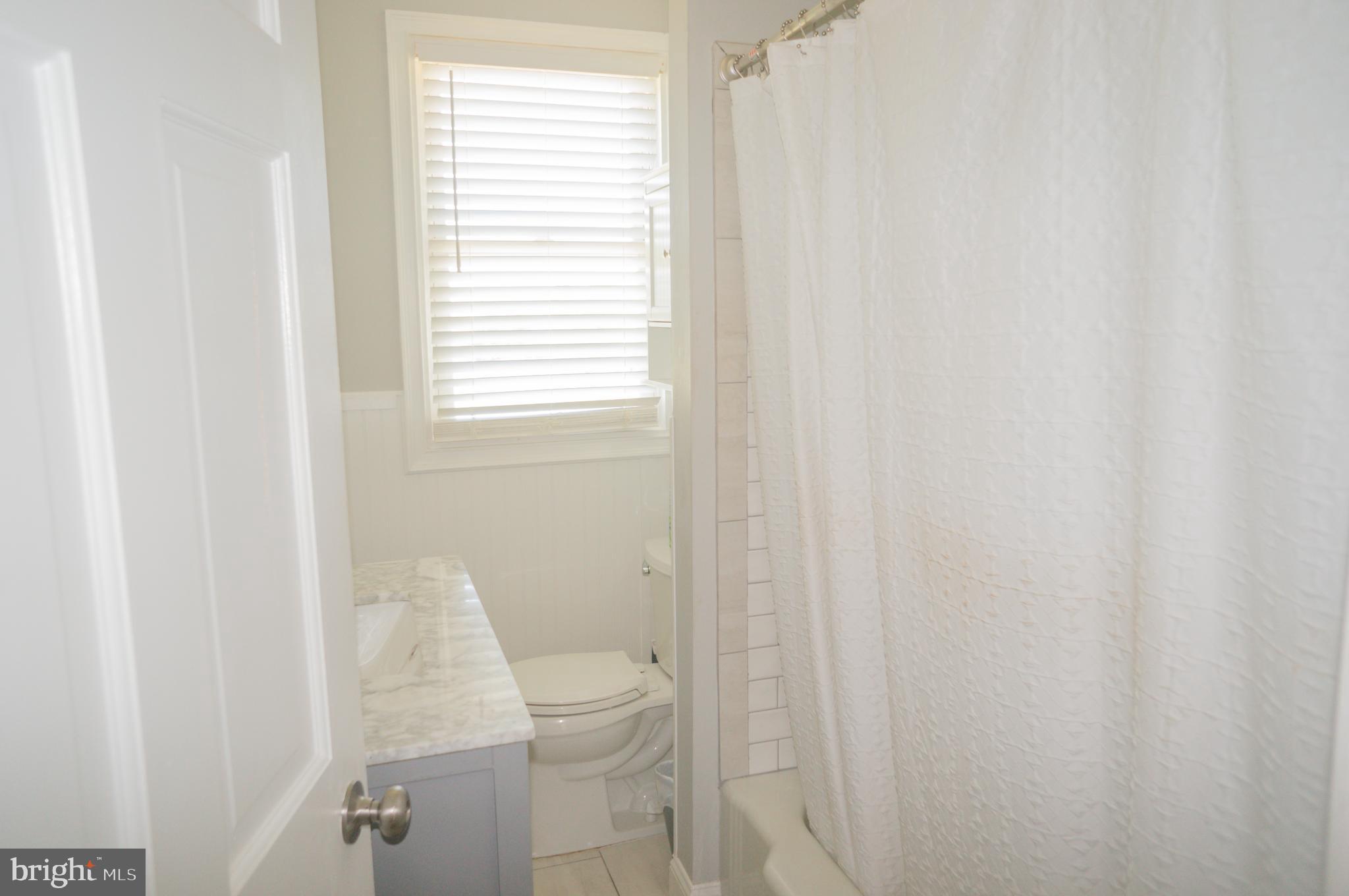 4205 Sams Creek Road New Windsor, MD 21776 - Photo 45 of 103 a white toilet sitting next to a window