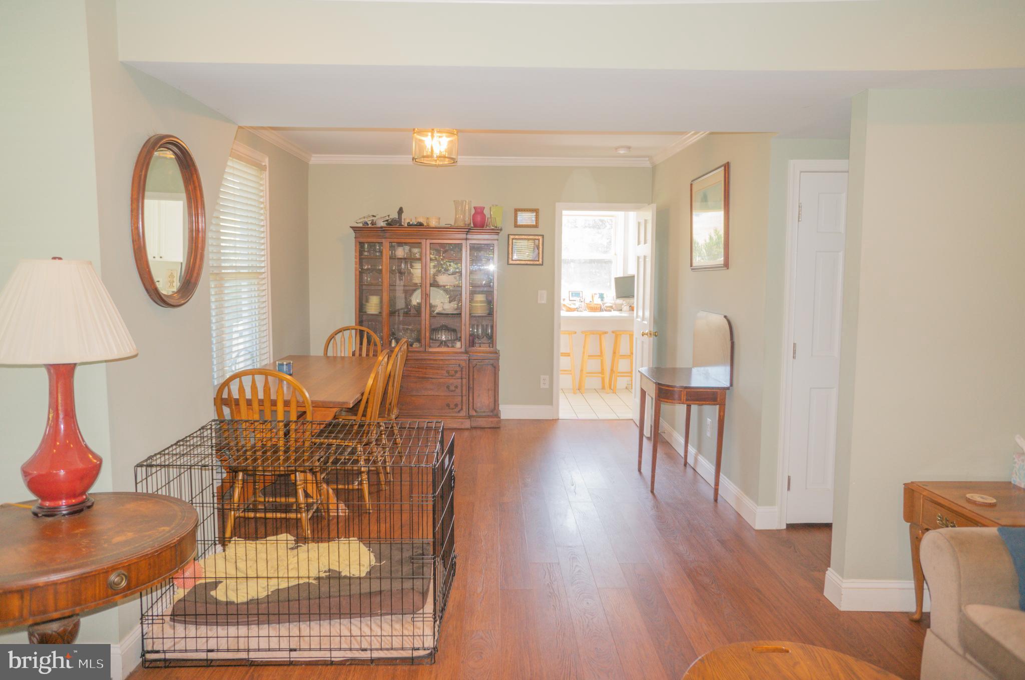 4205 Sams Creek Road New Windsor, MD 21776 - Photo 51 of 103 a dining room with furniture a rug and wooden floor