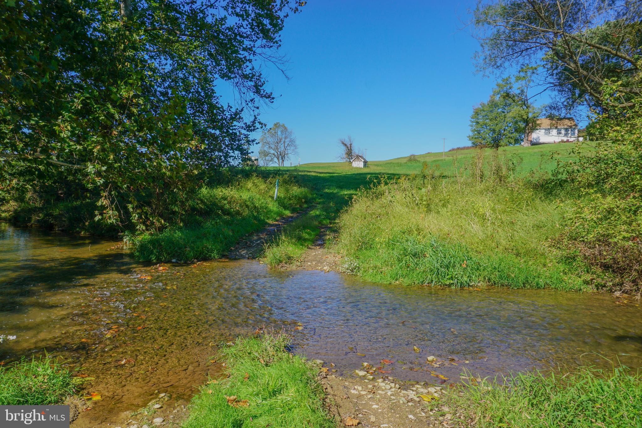 4205 Sams Creek Road New Windsor, MD 21776 - Photo 76 of 103 a view of a lake with a yard