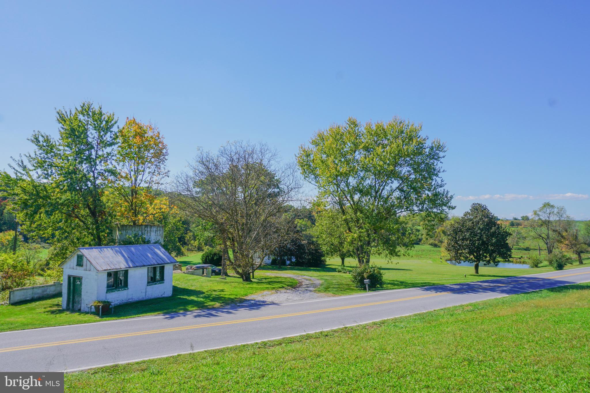 4205 Sams Creek Road New Windsor, MD 21776 - Photo 90 of 103 a view of a yard with a house in the background