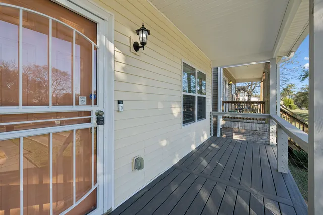 a view of a house with a porch and wooden floor