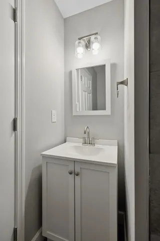 a bathroom with a sink and a mirror