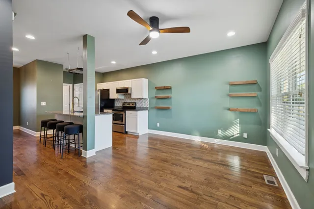 a view of kitchen with cabinets and wooden floor