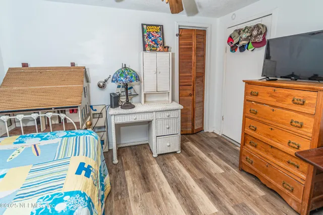 a bedroom with bed and a window