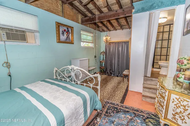 a room with gym equipment and a flat screen tv