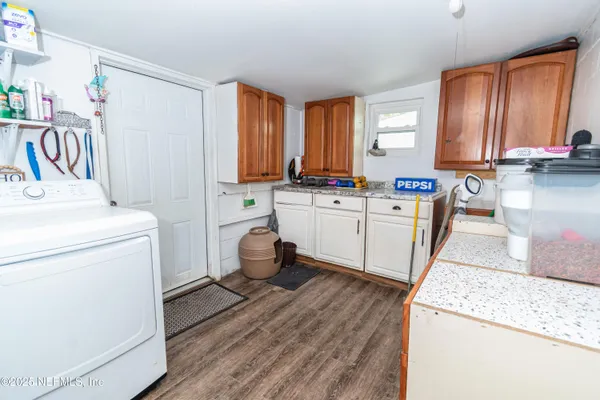 a kitchen with stainless steel appliances a refrigerator and a stove