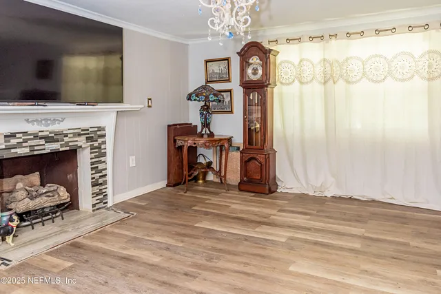 a view of a livingroom with furniture and a fireplace