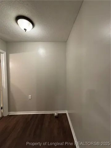 an empty room with a empty space and a window