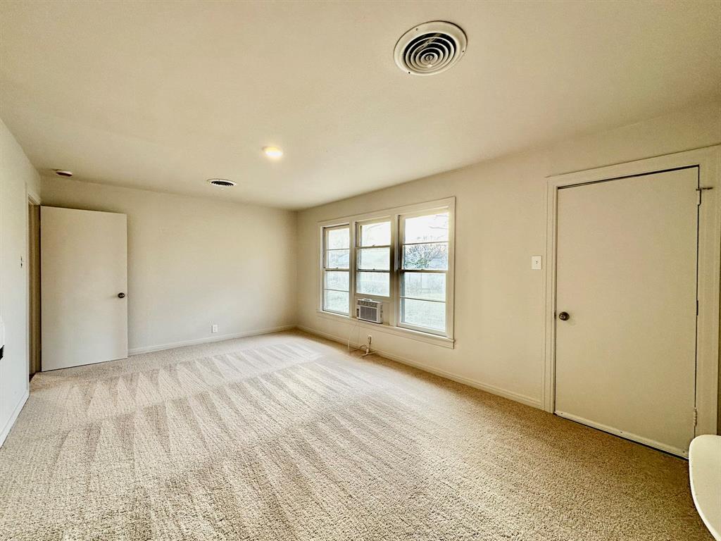 1103 Fair Avenue Gainesville, TX 76240 - Photo 13 of 19 a view of an empty room with a window