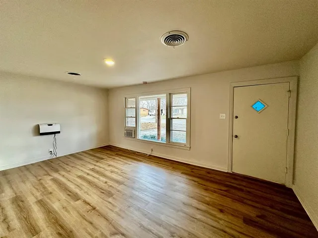 a view of an empty room and window