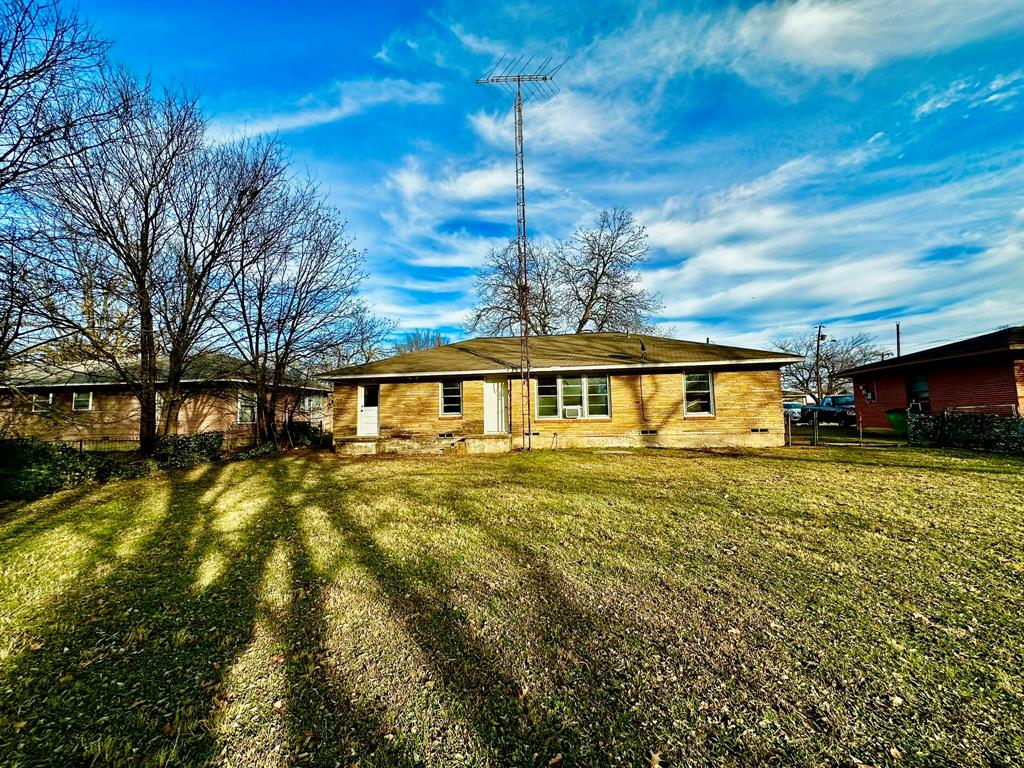 1103 Fair Avenue Gainesville, TX 76240 - Photo 17 of 19 a view of a house with a yard