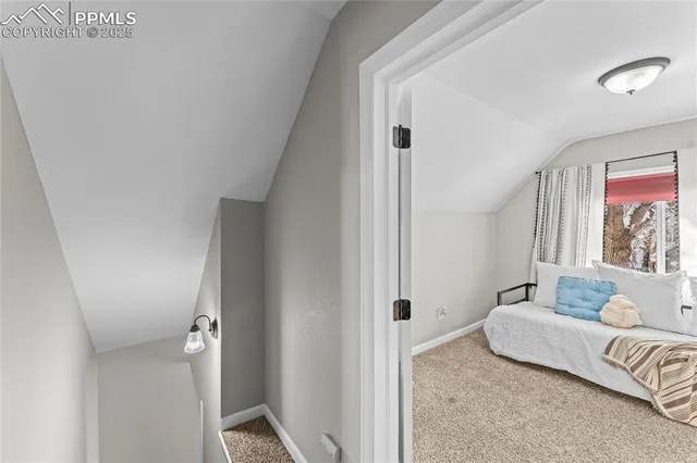 a bedroom with a bed and couch