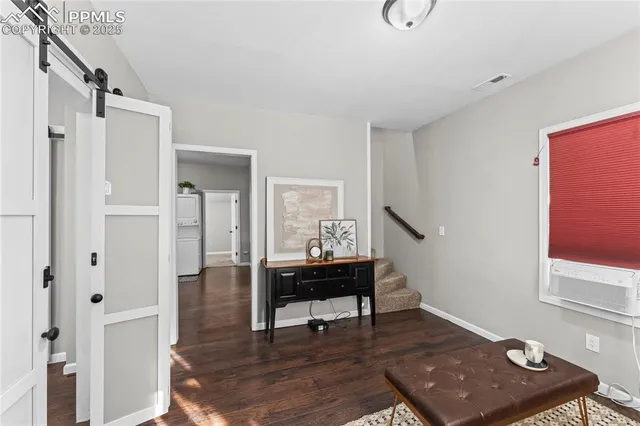 a view of a livingroom with furniture and window