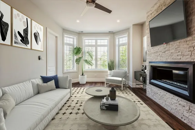 a living room with furniture and a fireplace