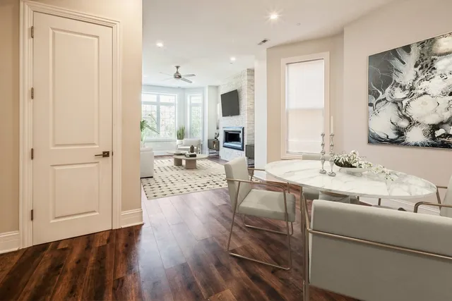 a kitchen with a sink dishwasher a stove and a refrigerator with wooden floor