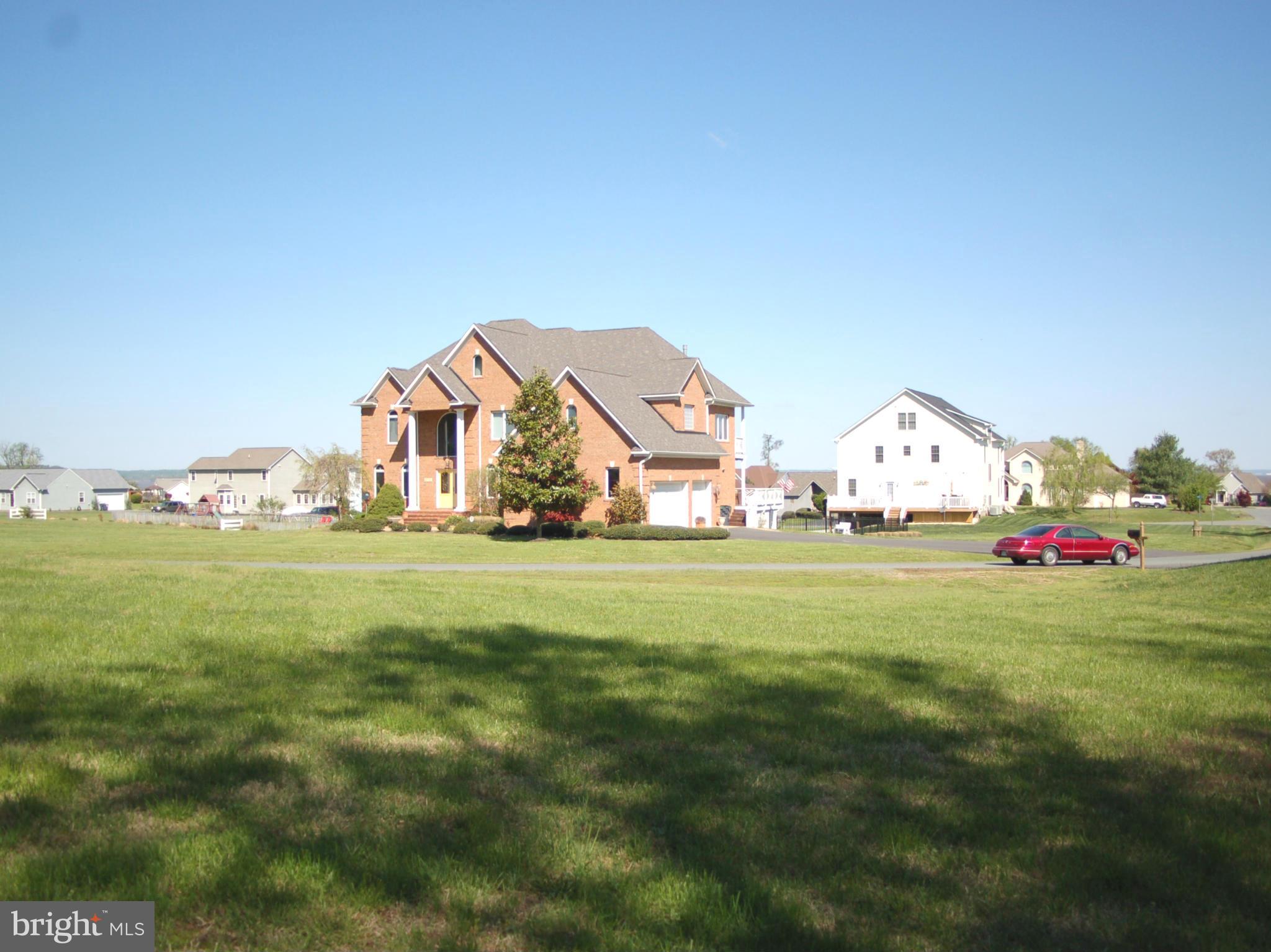 58 Marineview Road King George, VA 22485 - Photo 4 of 17 a view of white house with lots of trees