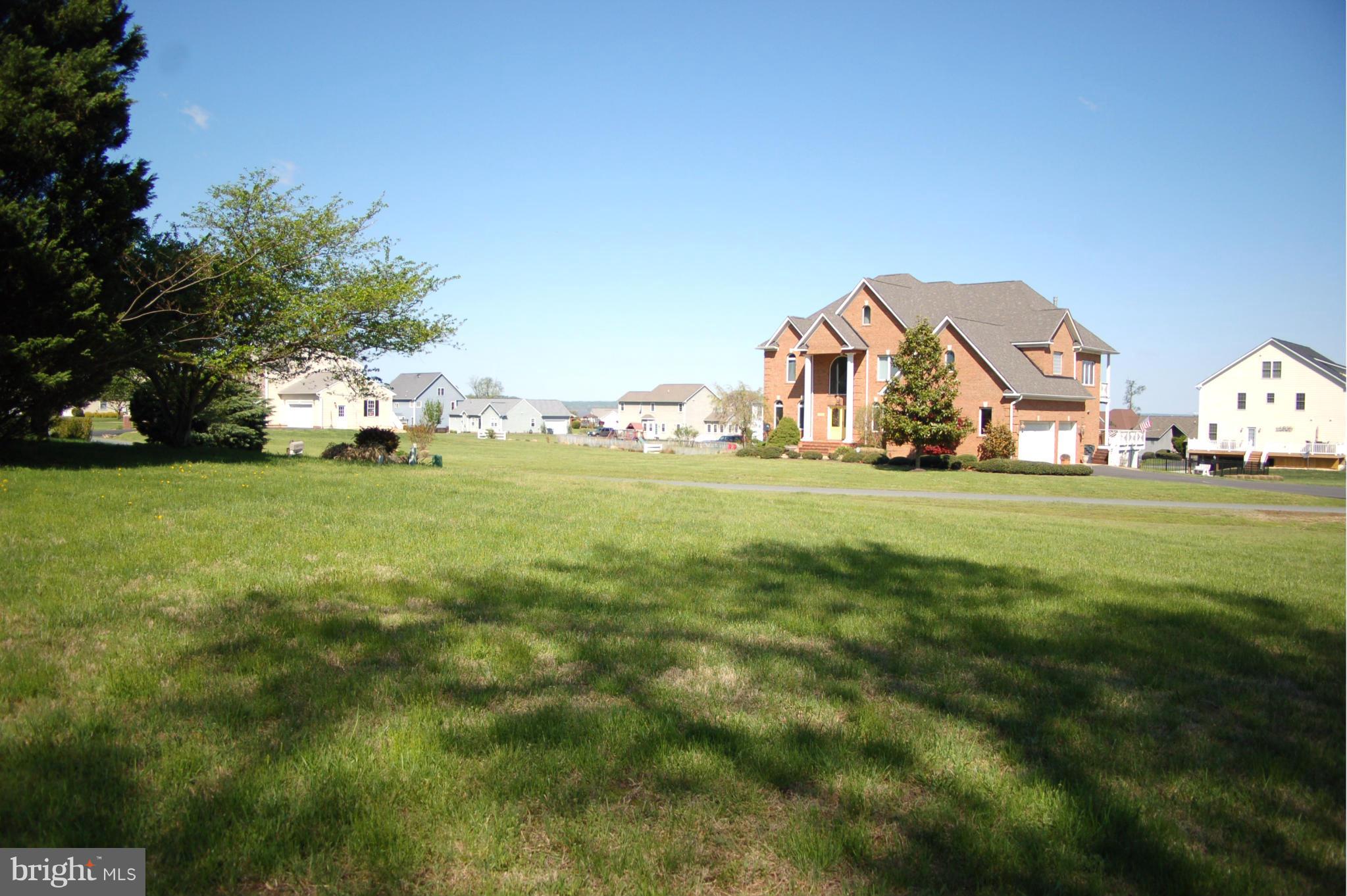 58 Marineview Road King George, VA 22485 - Photo 5 of 17 a view of a green field with some trees in front of it