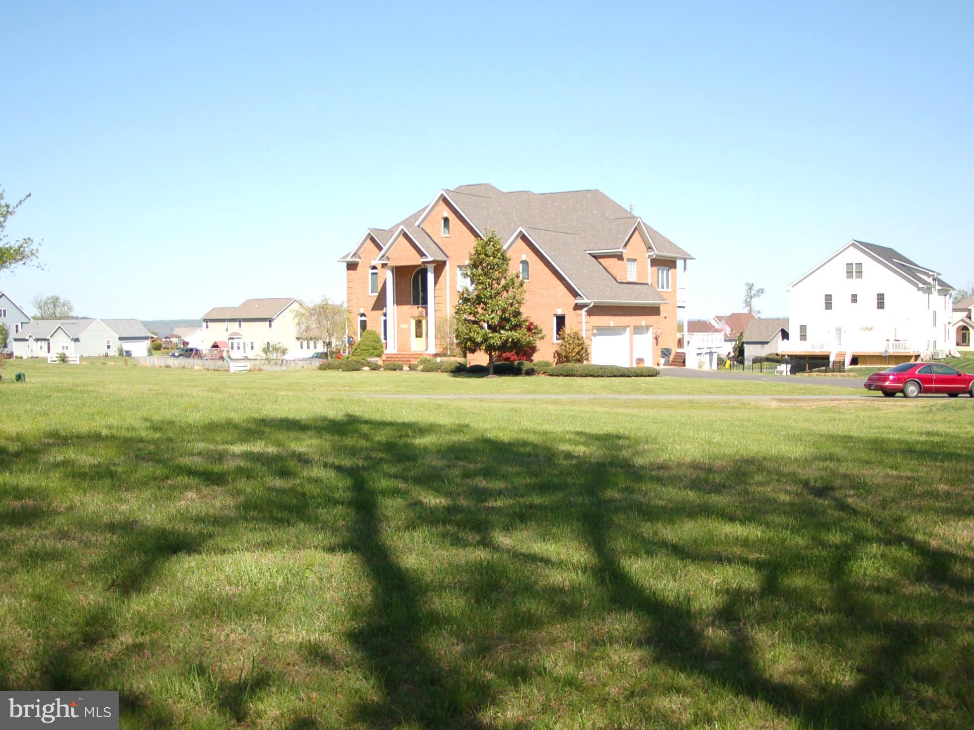 58 Marineview Road King George, VA 22485 - Photo 6 of 17 a view of a house with a big yard and large trees
