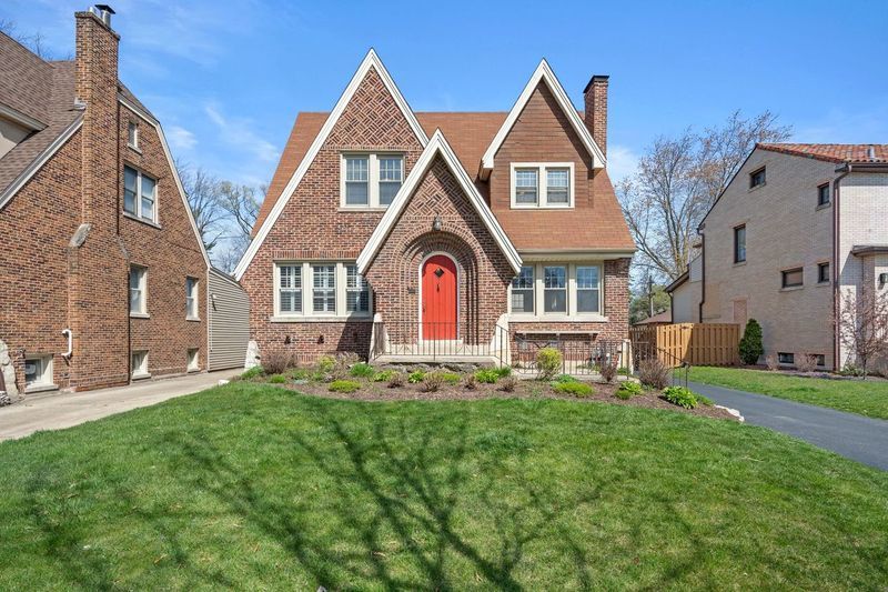 306 Southcote Road Riverside, IL 60546 - Photo 1 of 47 a front view of a house with a yard
