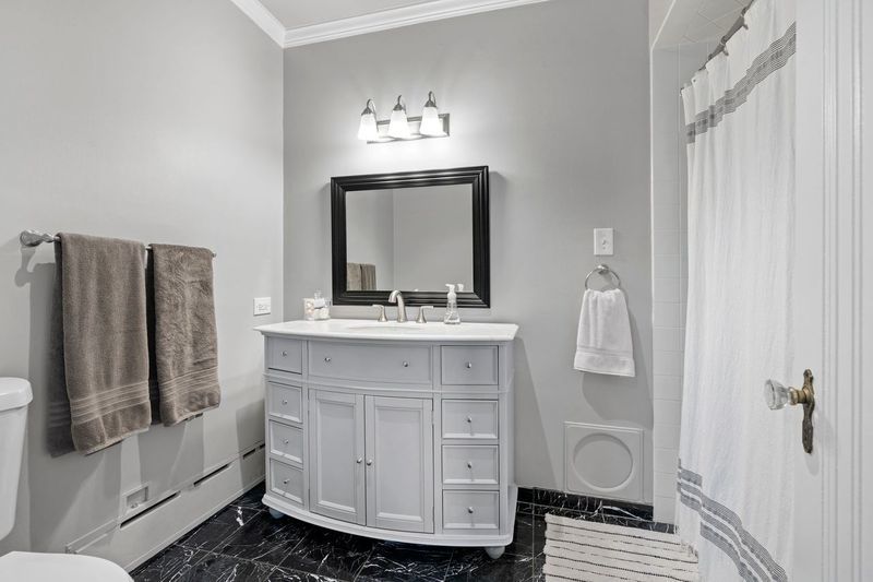 306 Southcote Road Riverside, IL 60546 - Photo 27 of 47 a bathroom with a sink and a mirror