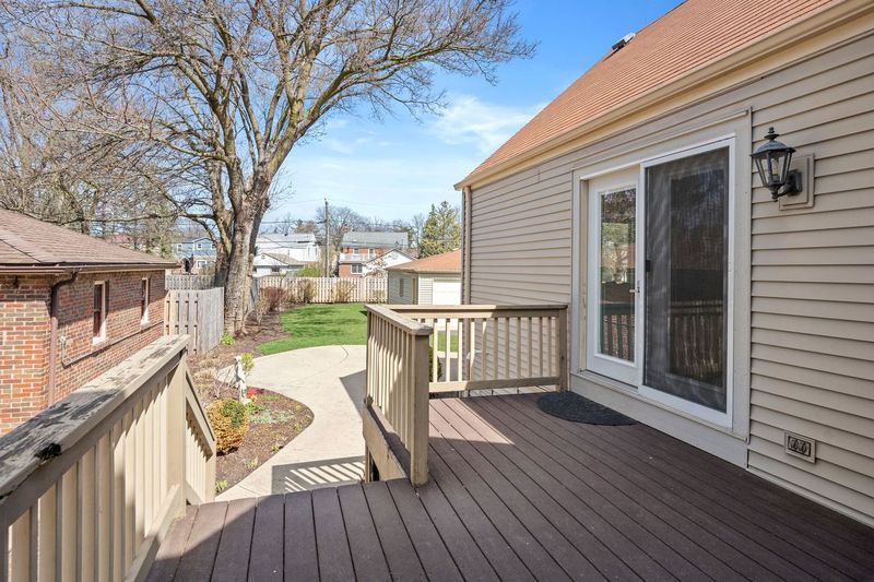 306 Southcote Road Riverside, IL 60546 - Photo 36 of 47 a view of a deck with two chair and wooden floor