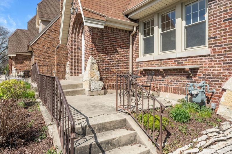 306 Southcote Road Riverside, IL 60546 - Photo 4 of 47 a view of a brick house with many windows