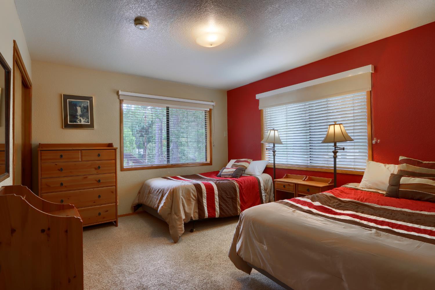 8041 Chilnualna Falls Road Wawona, CA 95389 - Photo 17 of 46 a bedroom with two beds and a window