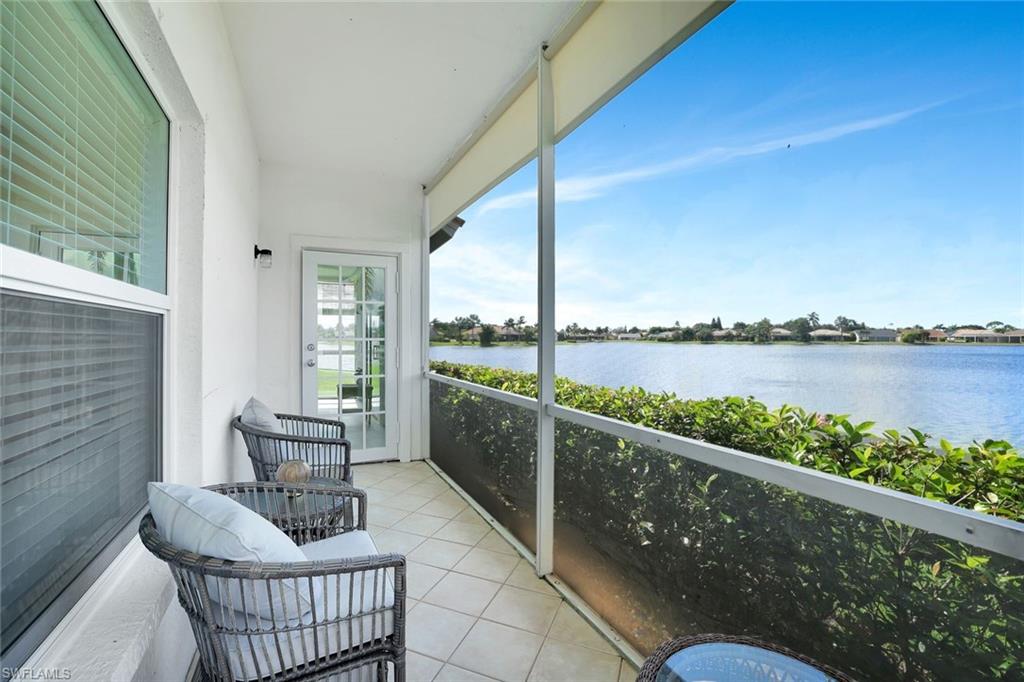 613 Windsor Square, Unit 101 Naples, FL 34104 - Photo 15 of 22 a balcony with furniture and city view