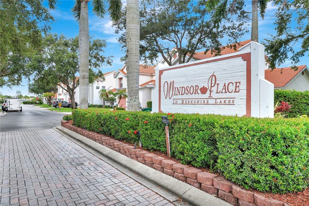 613 Windsor Square, Unit 101 Naples, FL 34104 - Photo 18 of 22 a sign on the side of a building