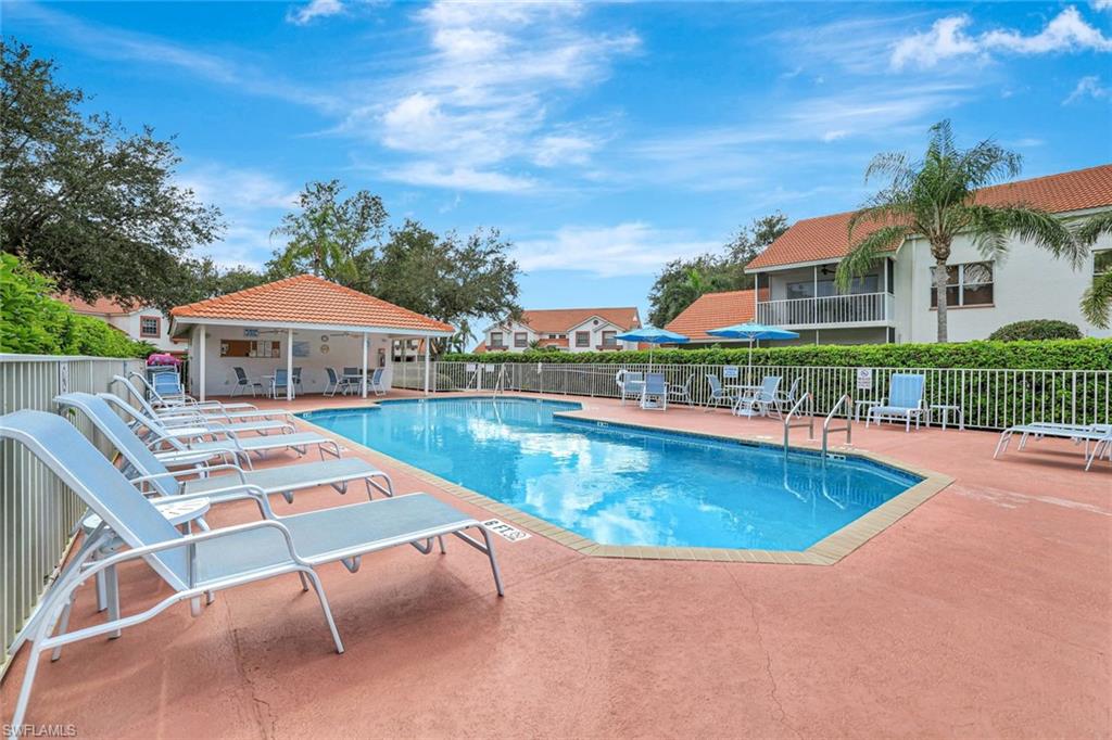 613 Windsor Square, Unit 101 Naples, FL 34104 - Photo 20 of 22 an aerial view of a house with swimming pool garden and outdoor seating