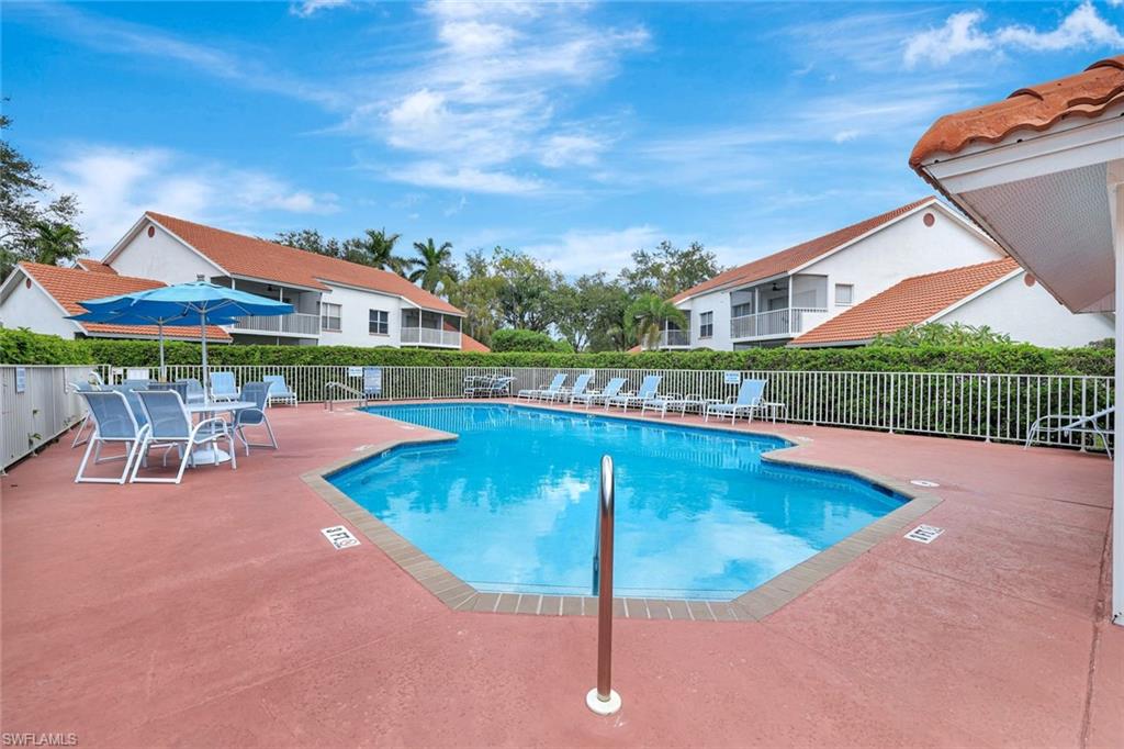 613 Windsor Square, Unit 101 Naples, FL 34104 - Photo 22 of 22 swimming pool view with a seating space