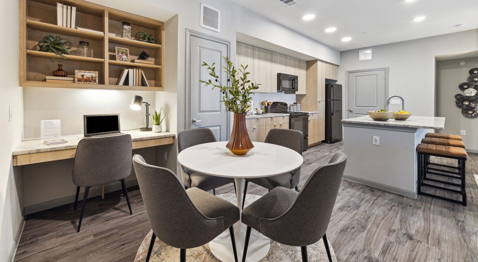 12752 North Houston Rosslyn Road, Unit 428 Houston, TX 77086 - Photo 3 of 14 a view of a dining room with furniture and wooden floor