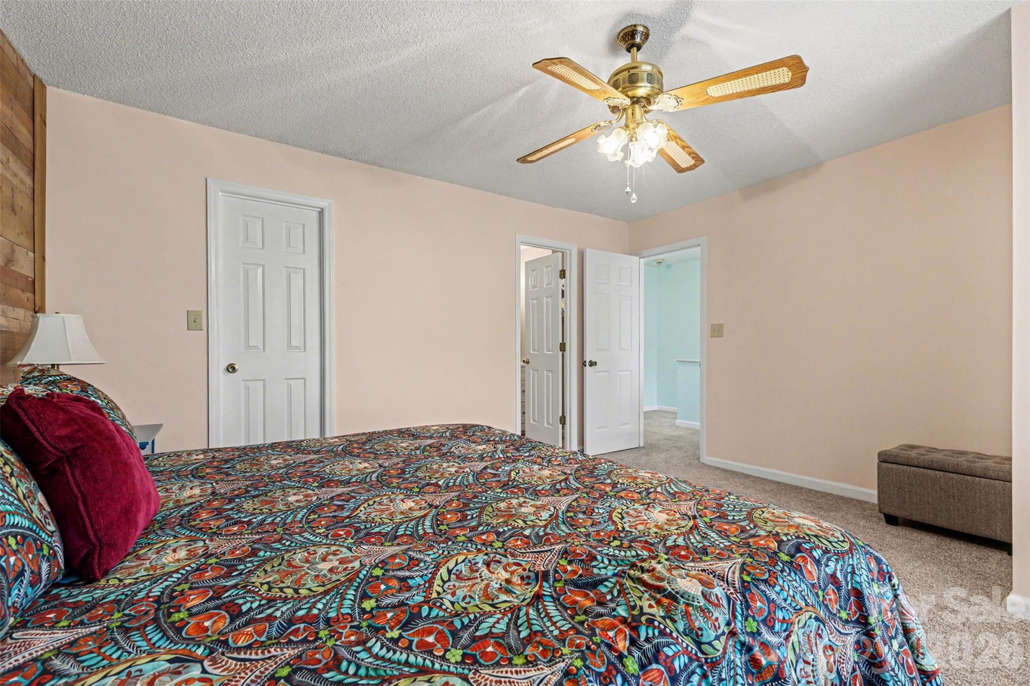 26030 Misty Way Drive Tega Cay, SC 29708 - Photo 16 of 43 a bedroom with bed and a chandelier