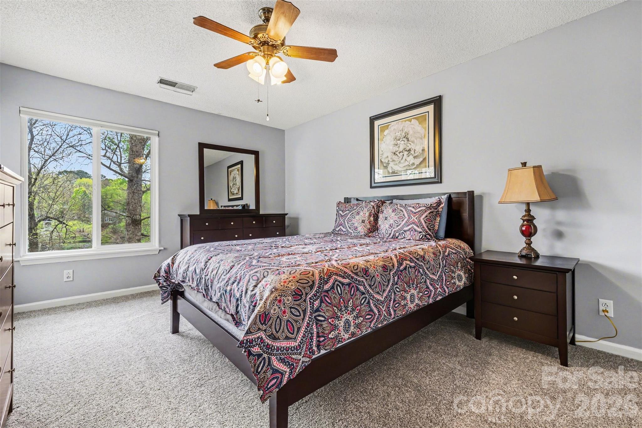 26030 Misty Way Drive Tega Cay, SC 29708 - Photo 19 of 43 a bedroom with a bed and a window