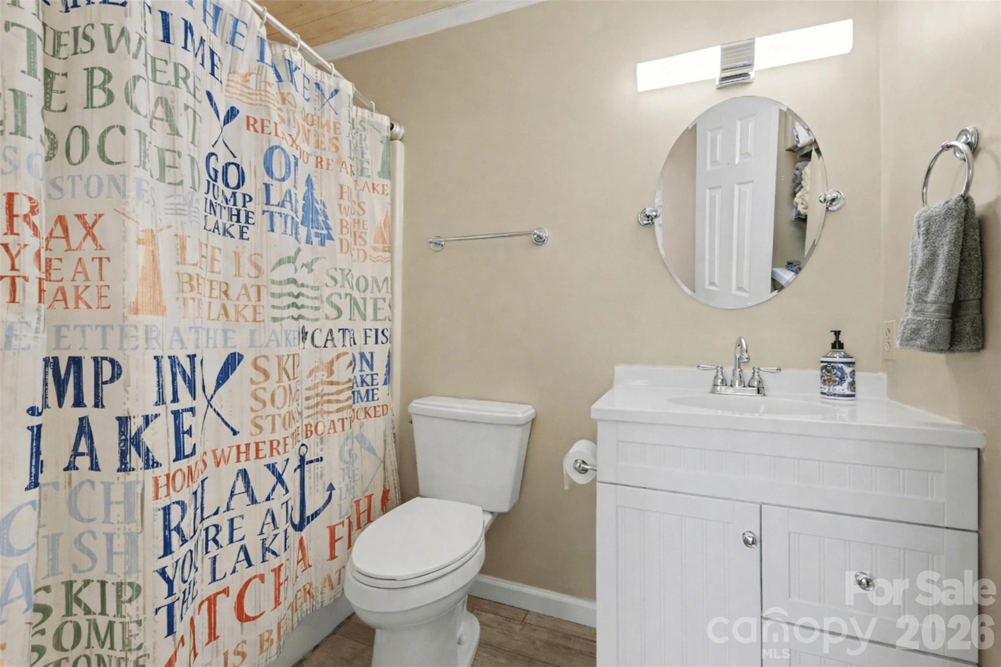 26030 Misty Way Drive Tega Cay, SC 29708 - Photo 22 of 43 a bathroom with a toilet sink and mirror