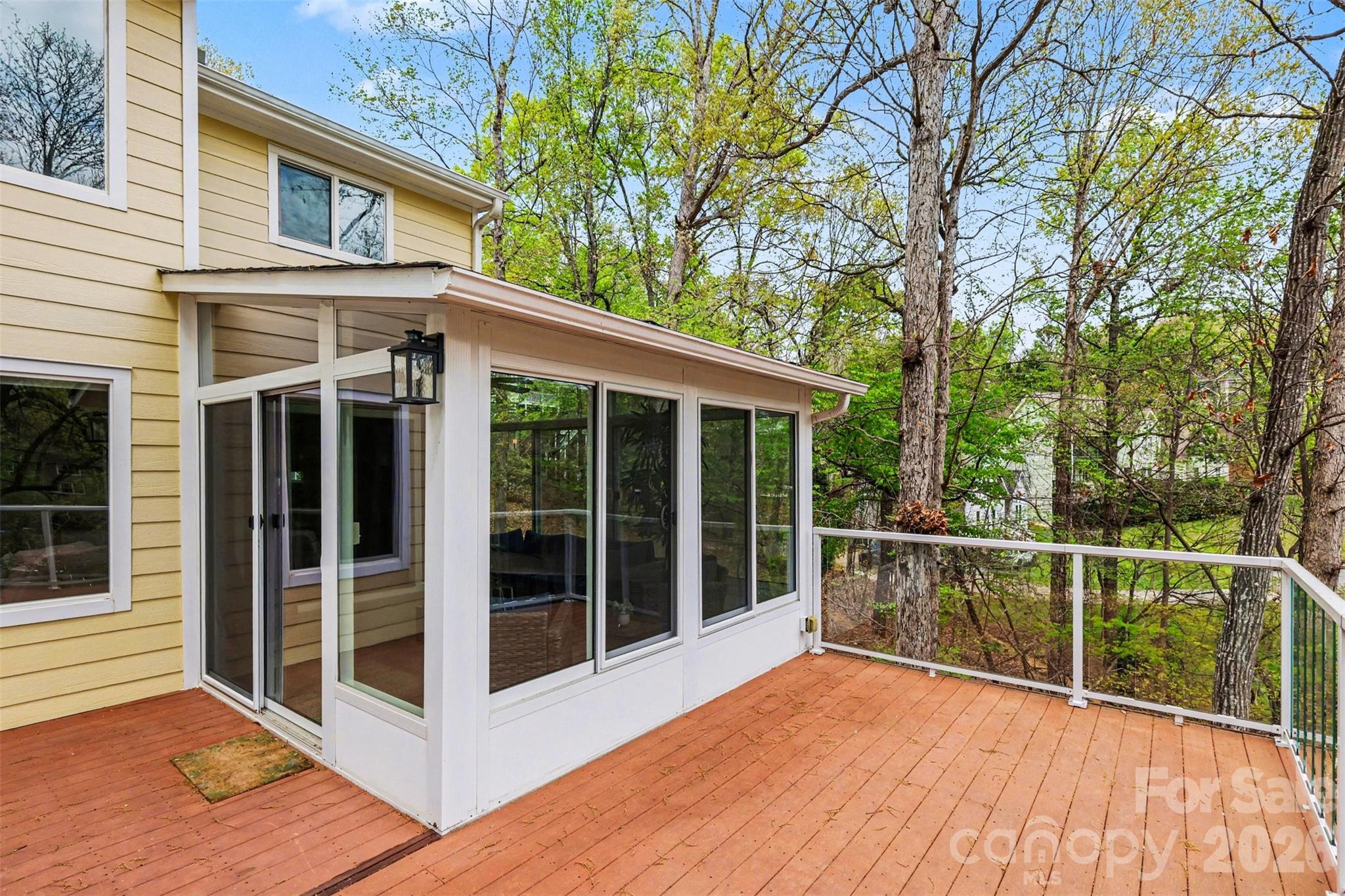 26030 Misty Way Drive Tega Cay, SC 29708 - Photo 25 of 43 a balcony with a large window and wooden floor