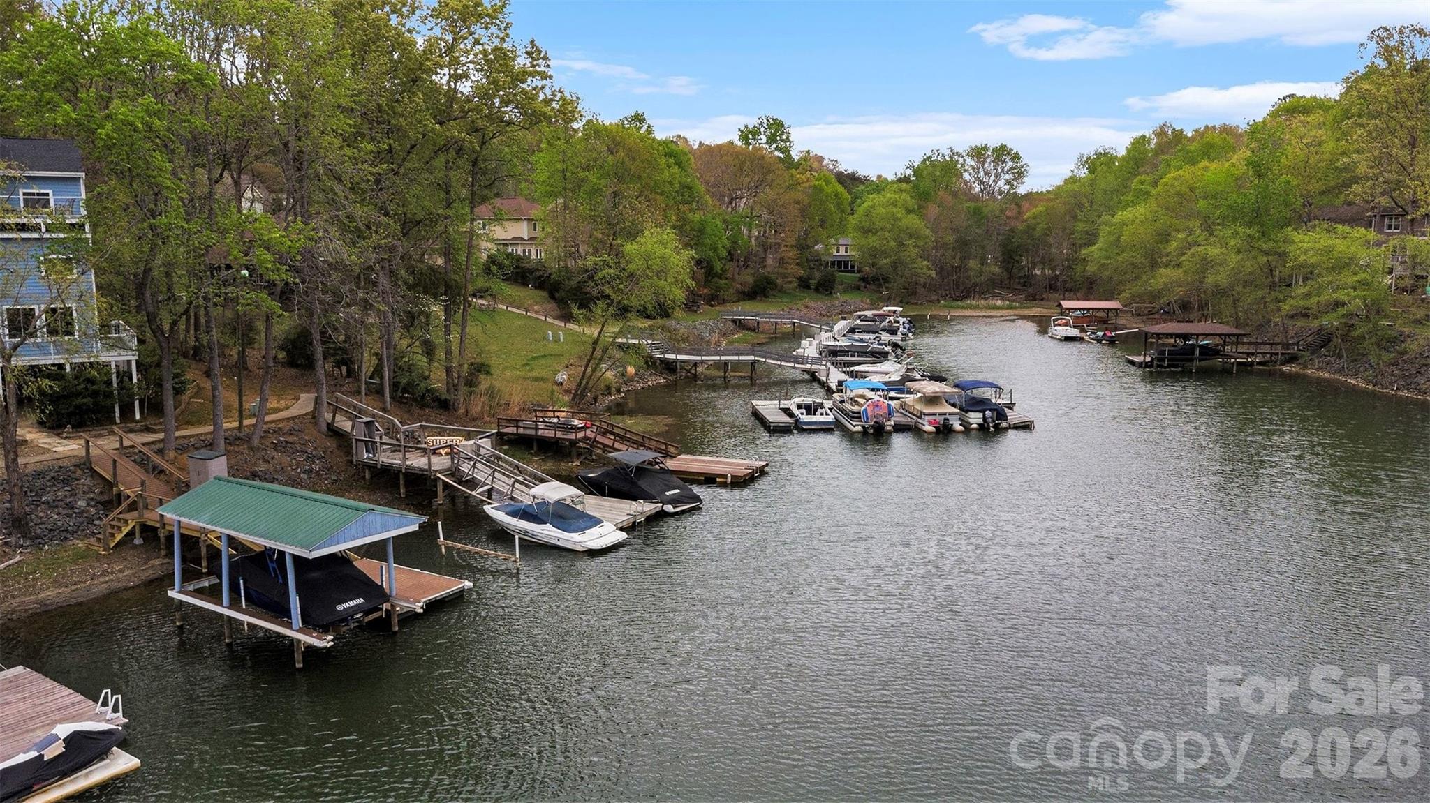 26030 Misty Way Drive Tega Cay, SC 29708 - Photo 36 of 43 a view of a lake with lawn chairs
