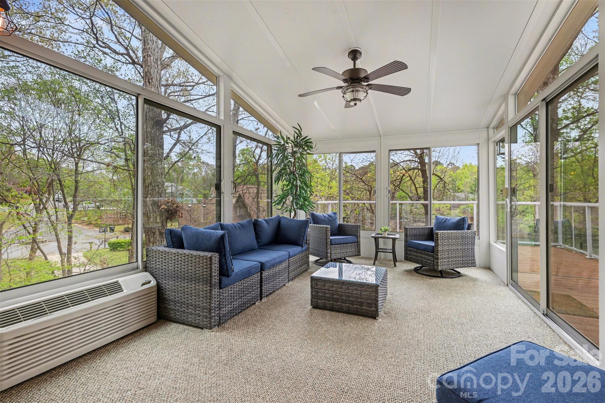 26030 Misty Way Drive Tega Cay, SC 29708 - Photo 4 of 43 a living room with furniture and a floor to ceiling window