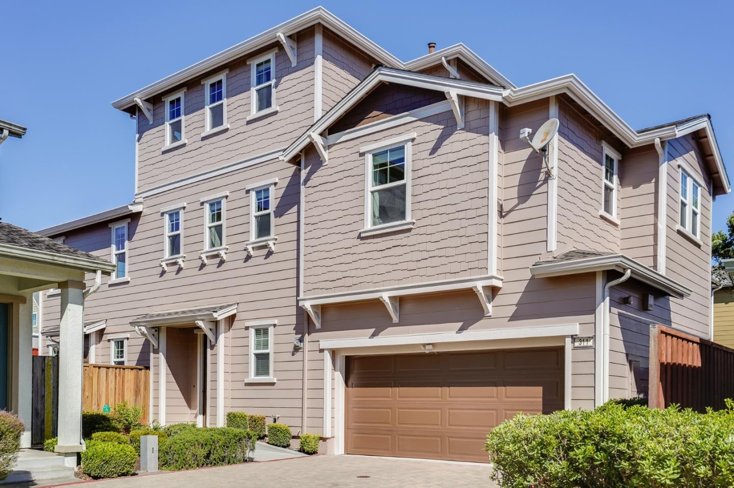 a front view of a house with garage