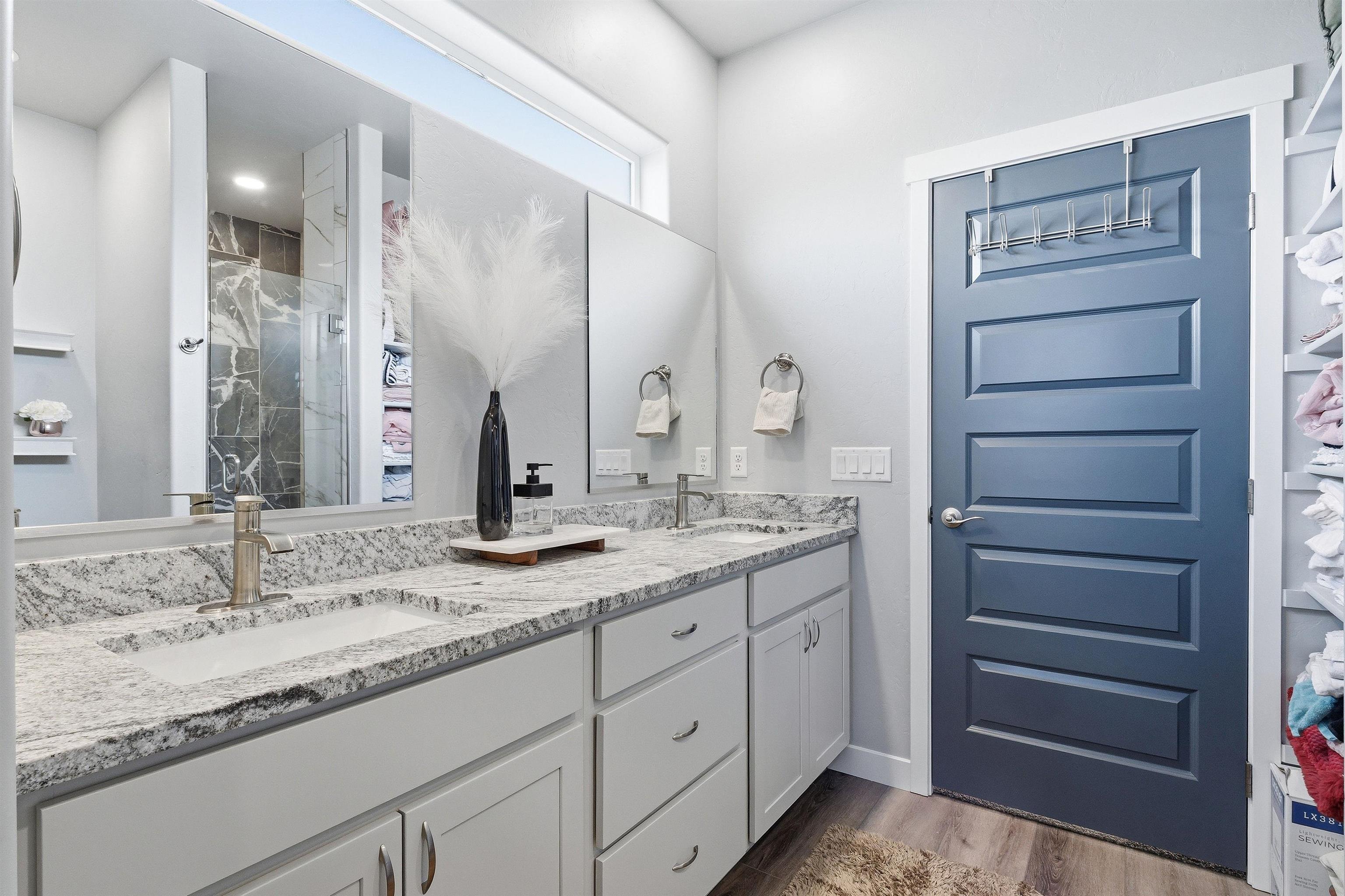 2459 Hamilton Road, Unit A Grand Junction, CO 81505 - Photo 16 of 27 a bathroom with a granite countertop sink double vanity and a mirror