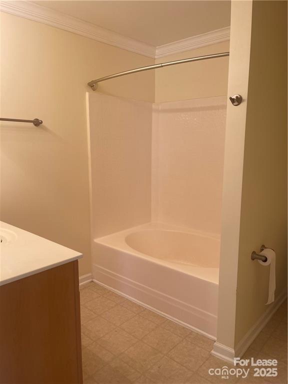 11917 Stratfield Pl Circle, Unit 118 Pineville, NC 28134 - Photo 17 of 28 a bathroom with a bathtub