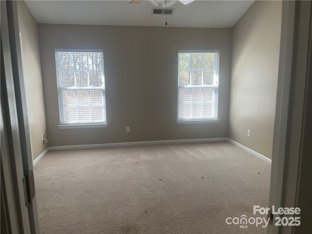 11917 Stratfield Pl Circle, Unit 118 Pineville, NC 28134 - Photo 19 of 28 an empty room with a window