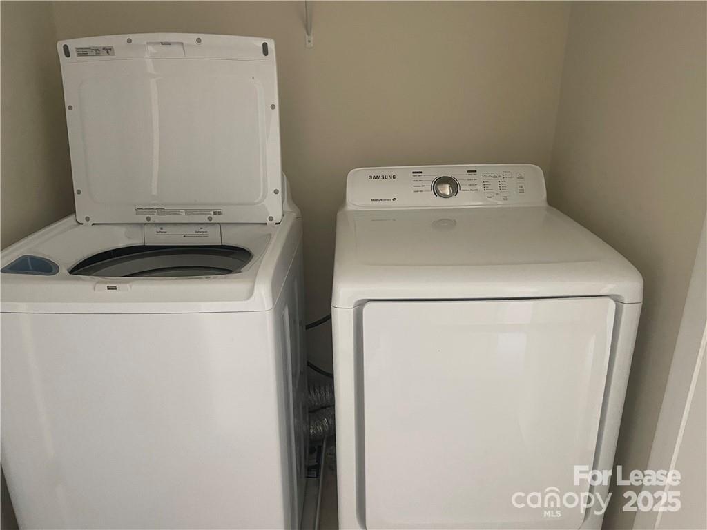 11917 Stratfield Pl Circle, Unit 118 Pineville, NC 28134 - Photo 24 of 28 a utility room with dryer and washer