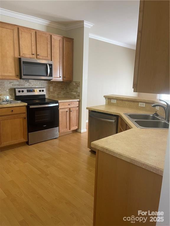 11917 Stratfield Pl Circle, Unit 118 Pineville, NC 28134 - Photo 4 of 28 a kitchen with a sink and a stove top oven