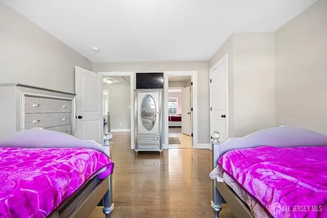 a bedroom with a bed and a view of bedroom