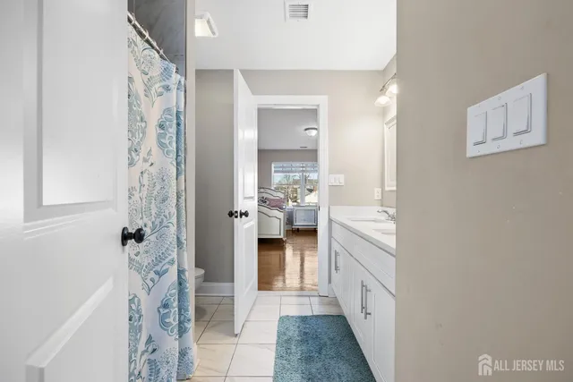 a bathroom with a shower and a sink